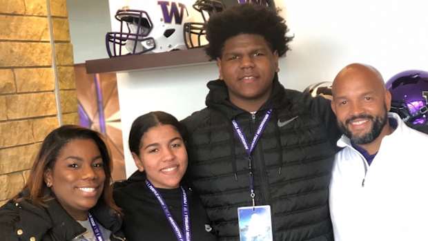 Josh Conerly and family members meet with UW coach Jimmy Lake.